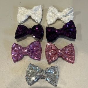 Set of 7.  Girls hair bows.  Alligator clips. 3 inches long.  Sparkly